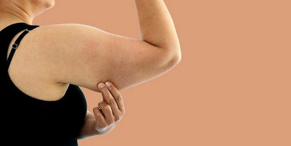 Toning Bingo Wings: Your Ultimate Guide to Sculpting Sleek Arms at the Gym 1 Woman doing push-ups for arm strength Cranleigh
