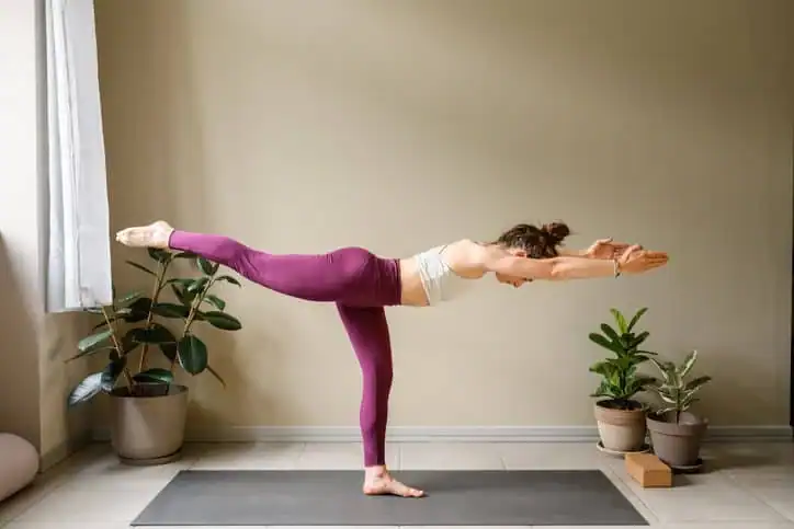 Achieving the Perfect Tone: How Often Should You Exercise for Results? 1 Woman doing Yoga exercise Cranleigh to help with toning the body.