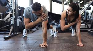 Sculpting Sleek Arms: The Essential Role of Cardio in Toning Without Bulking Up 1 Image of man and woman doing Cardio Cranleigh to tone their arms.